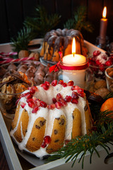 Festive table. decorated with the pomegranate cupcake and candle