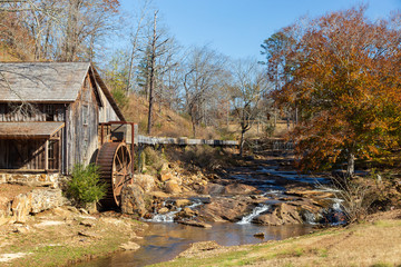 Fall colors at Gresham Mill with small casades in Canton, Georgia