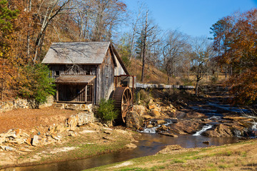 Historic Sixes Mill from the 1800s in Canton, Georgia, during autumn.