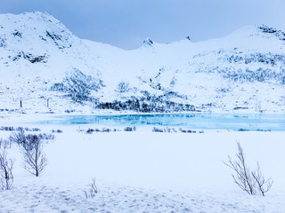 Winter scene with snow and ice of lake Ternvatnan, Austvagoya, Lofoten islands, Nordland, Norway
