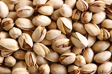 Close up of pistachios with the shells on