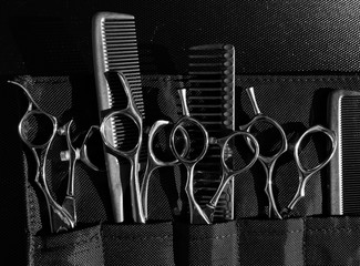Stylish professional barber scissors and combs, hairdresser salon concept, hairdressing tool set. Haircut accessories 