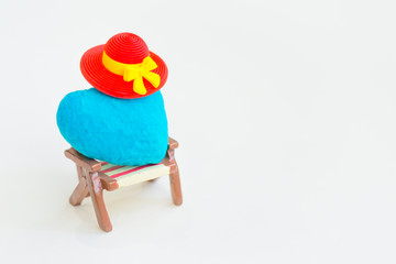 Heart on miniature chair,relax and rest concept.