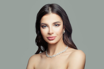 Fashion woman with makeup, diamond necklace and earrings