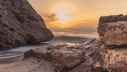 Nerja, Malaga, Andalusi, Spain - November 17, 2018: Nice sunrise on Burriana beach, village of Nerja, Spain