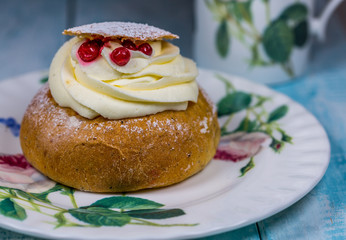 One Swedish Semla Cake with Cranberrys on Dish