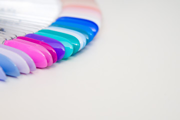 Nail Care And Manicure concept. Multicolor Nail Polish palette for Client's Nails choise. Woman In Beauty Salon. Copyspace for text
