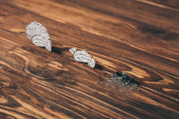 papers with brain disease as dementia symbol on wooden table