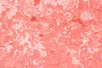 Texture, wall, concrete, living coral. It can be used as a background . Wall fragment with scratches and cracks