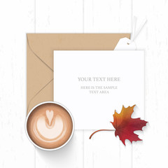 Flat lay top view elegant white composition paper brown kraft envelope autumn maple leaf tag and coffee on wooden background