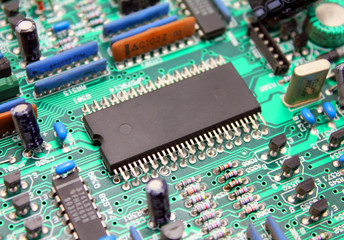 Electronic circuit board with microchip and transistors