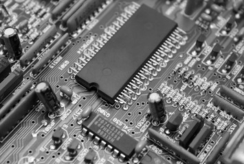 Electronic circuit board with microchip and transistors