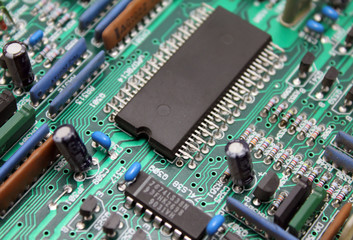 Electronic circuit board with microchip and transistors