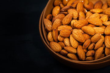 Almonds Nuts in the Bowl Background. Selective focus.