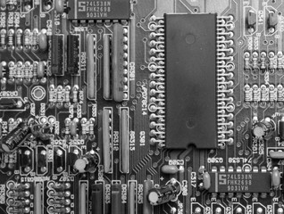 Electronic circuit board with microchip and transistors