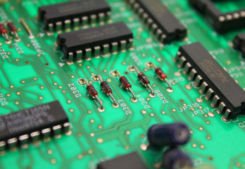 Electronic circuit board with microchip and transistors