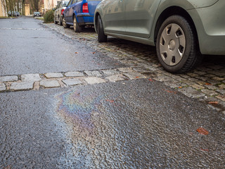 Oil spill on a car in the rain