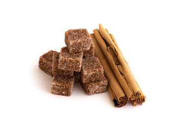 cinnamon sticks and isolated on a white background brown sugar cubes