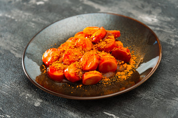 Tasty german sausage served with sauce