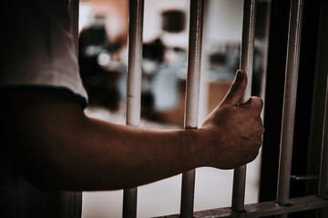 Hands of men desperate to catch the iron prison,prisoner concept,thailand people,Hope to be free.