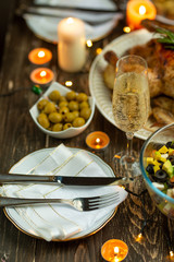Festive champagne glass and romantic candlelit dinner