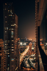Dubai at night with the Burj al arab in the distance