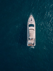 aerial drone top shot of a luxurious yacht on the sea