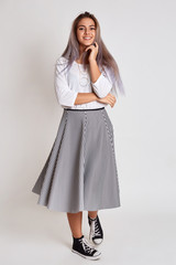 Happy young girl rejoices life. The girl rejoices and smiles having reached the goal.