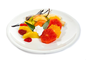 Fresh fruits salad on plate isolated on white