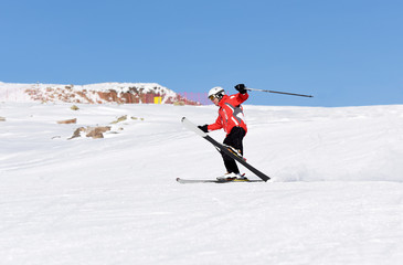 Fototapeta na wymiar Skier skiing downhill during sunny day in high mountains. Italy, Europe.