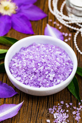 Fototapeta na wymiar Purple Clematis Spa Salt for Spa and Aromatherapy. Selective focus.