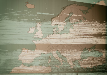 Map of Europe on a wooden background, texture, blurred image