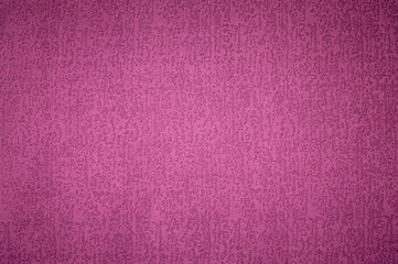 Textured background surface of textile upholstery furniture close-up. magenta red Color fabric structure