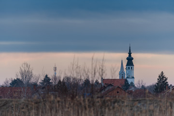 two churches in the village by the lake