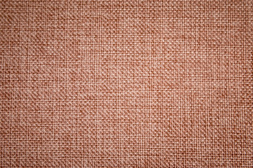 Textured background surface of textile upholstery furniture close-up. burlap brown color fabric structure