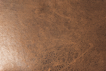 Textured background surface of textile upholstery furniture close-up. leatherette brown color fabric structure