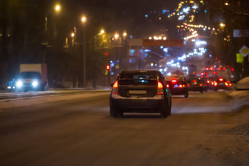  car traffic on a night winter street
