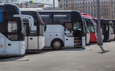 buses on parking on the background of cloudy sky © Yuri Bizgaimer