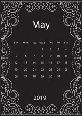 White Chalk drawing mandala doodles frame monthly calendar of 2019 year on black board
