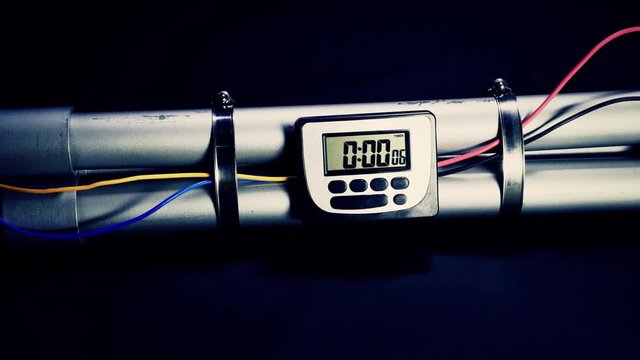 Pipe bomb with clock timer counting down, handheld motion