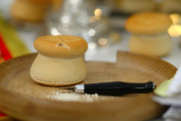 The Procurion liturgical liturgical bread used during Orthodox worship is located on a metal or wooden tray table