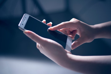 girl hand with touch screen on technology smartphone for business social network concept