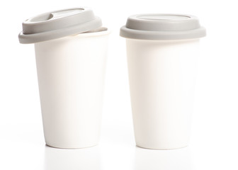 Two white cups mug with gray lid on white background isolation