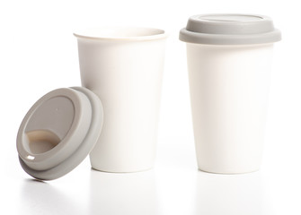 Two white cups mug with gray lid on white background isolation