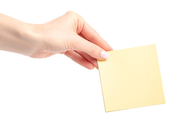 Yellow note paper in hand on white background isolation