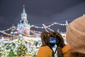 Red Square, Moscow, Russia - December 29, 2018: A photographer is shooting a new 30.1 megapixel...