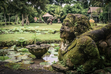 Traditional balinese stone sculpture of a woman