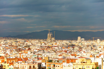 Fototapeta premium Aerial overview with Sagrada Familia on a sunny day