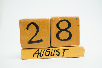 august 28th. Day 28 of month, handmade wood calendar isolated on white background. summer month, day of the year concept