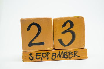 september 23rd. Day 23 of month, handmade wood calendar isolated on white background. autumn month, day of the year concept
